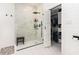 Elegant bathroom featuring a glass-enclosed shower, closet, and modern fixtures, offering a luxurious experience at 3757 Kingsley Dr., Myrtle Beach, SC 29588