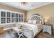 Comfortable bedroom features hardwood floors, plantation shutters, and an upholstered headboard, creating a cozy retreat at 3757 Kingsley Dr., Myrtle Beach, SC 29588