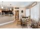 Bright breakfast nook with a glass-top table, elegant chairs, and shuttered windows at 3757 Kingsley Dr., Myrtle Beach, SC 29588