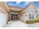 Elegant entrance with double doors, detailed windows, brick facade and manicured landscaping at 3757 Kingsley Dr., Myrtle Beach, SC 29588