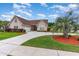 Beautiful single-story brick home with a well manicured lawn, long driveway, and palm tree at 3757 Kingsley Dr., Myrtle Beach, SC 29588