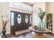 Welcoming foyer with hardwood floors, decorative table, and stylish double-door entrance at 3757 Kingsley Dr., Myrtle Beach, SC 29588