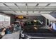 Organized garage with storage shelves and a modern car parked inside at 3757 Kingsley Dr., Myrtle Beach, SC 29588