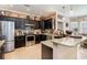 Modern kitchen with dark cabinets, stainless steel appliances, and granite countertops at 3757 Kingsley Dr., Myrtle Beach, SC 29588