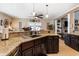 Spacious kitchen featuring granite countertops, dark cabinets, and an open layout at 3757 Kingsley Dr., Myrtle Beach, SC 29588