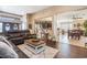 Open-concept living room flowing into dining and kitchen areas with dark leather furniture at 3757 Kingsley Dr., Myrtle Beach, SC 29588