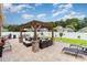 Beautiful outdoor patio featuring a pergola, lounge furniture, and a well-manicured lawn at 3757 Kingsley Dr., Myrtle Beach, SC 29588