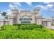 Community sign displaying 'Queens Harbour', surrounded by lush greenery and manicured landscaping at 3757 Kingsley Dr., Myrtle Beach, SC 29588