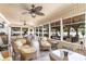 Bright sunroom with a view of an outdoor kitchen and seating area at 3757 Kingsley Dr., Myrtle Beach, SC 29588