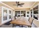 Sunroom with a large table and chairs, perfect for outdoor dining at 3757 Kingsley Dr., Myrtle Beach, SC 29588