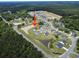 Beautiful aerial view of a residential community with lush greenery and a tranquil pond at 40 Little Peru Ct., Georgetown, SC 29440