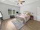 Well-lit bedroom with tray ceilings and exercise equipment at 40 Little Peru Ct., Georgetown, SC 29440