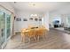 Open concept dining room with wooden table set for six; flows into the living area at 40 Little Peru Ct., Georgetown, SC 29440