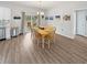 Bright dining room features a dining table set for six, and sliding glass doors to outdoor area at 40 Little Peru Ct., Georgetown, SC 29440