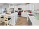 Modern white kitchen featuring a central island with bar seating, stainless steel appliances and stylish decor at 40 Little Peru Ct., Georgetown, SC 29440