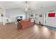 Cozy living room featuring wood floors, a ceiling fan, and a comfortable seating arrangement at 40 Little Peru Ct., Georgetown, SC 29440