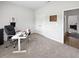 Bright office area with desk, chair, and view to connecting room at 40 Little Peru Ct., Georgetown, SC 29440