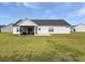 Well-maintained backyard with green lawn, featuring a cozy screened porch at 40 Little Peru Ct., Georgetown, SC 29440