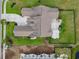 Backyard aerial view of a home featuring a patio, green grass, and a black fence at 400 Palo Verde Dr., Myrtle Beach, SC 29579
