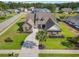 Aerial view of a home featuring lush landscaping, a circular driveway, and a well-maintained lawn at 400 Palo Verde Dr., Myrtle Beach, SC 29579