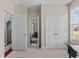 Bedroom showcasing a doorway leading to another room and natural lighting from a window at 400 Palo Verde Dr., Myrtle Beach, SC 29579