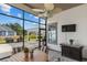 Relaxing screened patio featuring a ceiling fan, a dining table, and views of the backyard at 400 Palo Verde Dr., Myrtle Beach, SC 29579