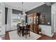 Cozy dining room featuring a table, wine rack, large window and elegant chandelier at 400 Palo Verde Dr., Myrtle Beach, SC 29579