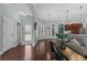 Open concept living room with hardwood floors, connecting to the kitchen area at 400 Palo Verde Dr., Myrtle Beach, SC 29579