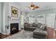 Open-concept living room with cozy fireplace and modern furnishings at 400 Palo Verde Dr., Myrtle Beach, SC 29579