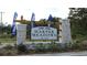 Harper Meadows community sign with stone pillars and landscaping at the entrance at 402 Glade Ct., Loris, SC 29569
