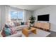 Bright living room with comfortable seating, a large window, and stylish decor at 402 Glade Ct., Loris, SC 29569