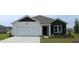 Charming single-Gathering home with a well-maintained lawn and a two-car garage at 410 Glade Ct., Loris, SC 29569