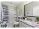 Bathroom features a shower and tub combination with decorative gray and marble counter at 448 Papyrus Circle # 448, Little River, SC 29566