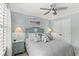 Cozy bedroom features a decorative seashell headboard and coastal-themed decor with a ceiling fan at 448 Papyrus Circle # 448, Little River, SC 29566