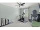 This spare bedroom features a Peloton bike, desk, and neutral carpet at 448 Papyrus Circle # 448, Little River, SC 29566