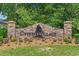 Stone sign for Cypress Village community entrance, surrounded by landscaped flower beds at 448 Papyrus Circle # 448, Little River, SC 29566