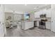 Modern kitchen with stainless steel appliances, granite countertops, and an open layout connecting to the living area at 448 Papyrus Circle # 448, Little River, SC 29566