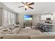 Open-concept living room showcasing kitchen, bright decor, and stainless steel appliances at 448 Papyrus Circle # 448, Little River, SC 29566