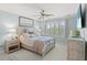 Cozy bedroom features cool colors, a ceiling fan, and shutter blinds at 448 Papyrus Circle # 448, Little River, SC 29566