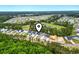 Aerial view of the community showcases homes with a golf course, ponds and lush surroundings at 452 Sun Colony Blvd., Longs, SC 29568