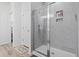 Bathroom with a glass-enclosed shower and tiled walls at 452 Sun Colony Blvd., Longs, SC 29568