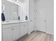 Bathroom featuring a double sink vanity with white cabinets and modern fixtures at 452 Sun Colony Blvd., Longs, SC 29568