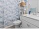Well-organized bathroom with seashell shower curtain and ample storage at 452 Sun Colony Blvd., Longs, SC 29568