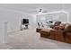 Large carpeted bonus room with a ceiling fan offers versatility as a media room, office, or play area at 452 Sun Colony Blvd., Longs, SC 29568