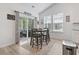 Bright dining area with a sliding glass door leading to an outdoor patio area at 452 Sun Colony Blvd., Longs, SC 29568