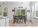 Dining area featuring a wooden table set, natural light, and sliding glass door to the exterior at 452 Sun Colony Blvd., Longs, SC 29568
