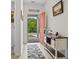 Bright entryway with a console table, wood floors, and an orange front door at 452 Sun Colony Blvd., Longs, SC 29568