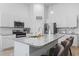 Bright kitchen featuring white cabinets, stainless steel appliances and eat-in island at 452 Sun Colony Blvd., Longs, SC 29568