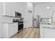 Bright kitchen features stainless steel appliances, granite countertops, and white cabinetry at 452 Sun Colony Blvd., Longs, SC 29568
