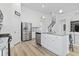 Open kitchen boasts a center island with sink, stainless appliances, and modern finishes at 452 Sun Colony Blvd., Longs, SC 29568